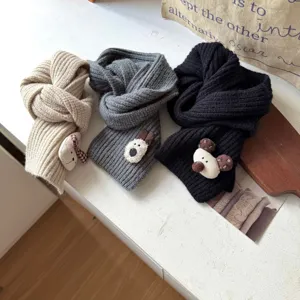 Kids winter warm knitted scarf detail, cute cartoon animal plush design, soft neck cover.