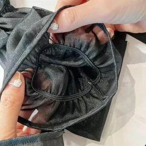 Manches anti-UV femme été noires scintillantes vue détaillée, tissu élastique confortable.