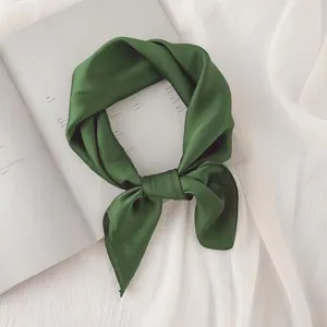Dark green solid silk square scarf detail shot, elegant fabric texture for stylish neckerchief.