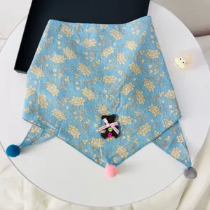 Kids blue floral triangle scarf with cute bear patch and pom pom decorations for autumn.