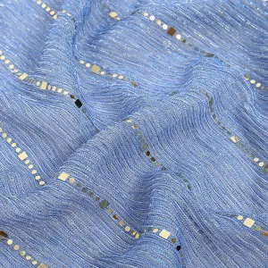 Close up detail of blue sparkly sequin gauze fabric scarf with shimmering metallic threads.