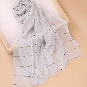Detailed view of the women's shimmering sequin long scarf, perfect for seasonal daily style.