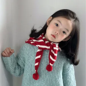 Cute kids knitted scarf autumn winter red white striped warm bib with cute pom poms.