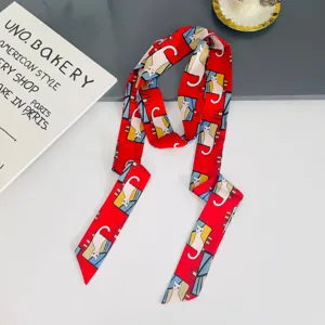 Red cat print silk scarf detail view, elegant long ribbon for hair and neck styling accessory daily.
