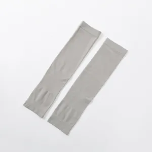 Detailed view of grey cooling arm sleeves with seamless knit pattern, ideal for sports.