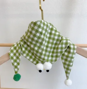 Green gingham baby scarf with cute plush eyes and pom-pom ends, pure cotton neck warmer bib.