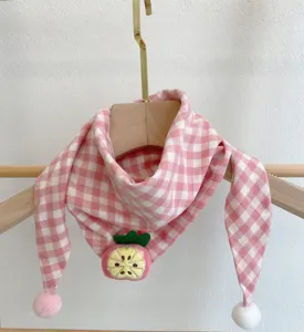 Cute pink plaid baby scarf with adorable fruit embroidery and fluffy pom-poms for daily wear.
