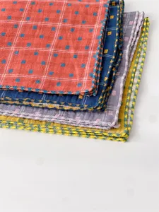 Close-up detail of soft cotton grid handkerchiefs with delicate scalloped edges, multi-color.