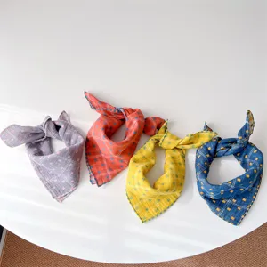 Detail view of multi-color plaid baby bandanas, soft breathable neck scarves, Korean style.
