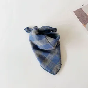 Detail view of the blue and grey plaid baby scarf, versatile thin neck warmer for kids.