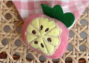 Cute cotton plaid baby scarf with plush fruit decor, soft neck warmer for spring daily wear.