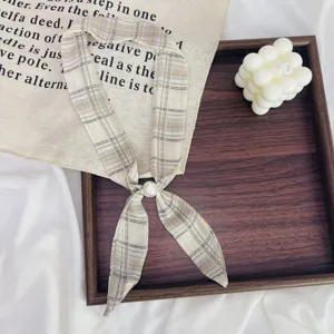 Plaid narrow scarf detail, elegant neck ribbon with faux pearl ring, versatile fashion accessory.