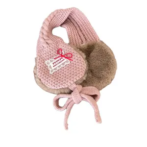 Pink fleece-lined knit kids earmuffs with cute bow tie and warm plush for winter outdoor.