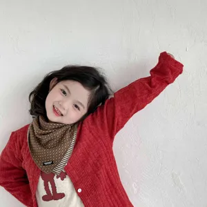 Cute baby polka dot triangle scarf detail shot, warm cotton toddler bib in autumn and winter.