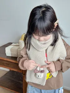 Kids winter knit scarf detail, cute rabbit plush decor with plaid bow, soft warm neck warmer.