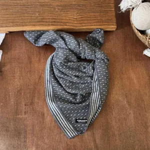 Details of the kids cotton polka dot and striped double-sided baby scarf close up view.