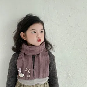 Kids knitted scarf detail, cute duck decor, warm autumn winter accessory for toddler boys and girls.