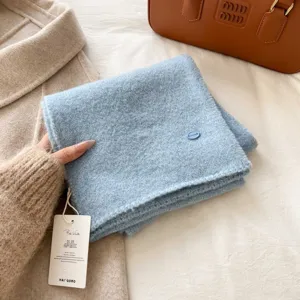 Soft knitted blue scarf detail, cozy winter neckerchief warm stylish accessory for women.