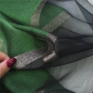 Elegant long silk shawl scarf for women, green and black sheer design with sparkly gold stripes.