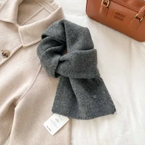 Cozy winter grey knitted scarf for women, soft warm stylish fashion neck warmer and casual wrap.