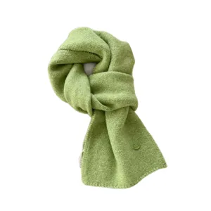 Cozy green knitted scarf for women, solid color winter warm neck wrap, soft casual apparel.