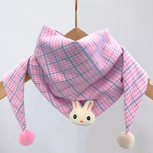 Detailed view of baby pink plaid scarf with cute plush rabbit and pom-poms for daily wear.