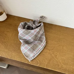 Close-up of Korean style plaid baby square scarf with soft fabric and neat edges.
