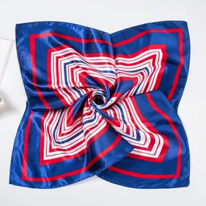 Silk square scarf detail view, blue with red and white geometric stripe pattern design.