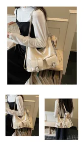 Close-up detail of white soft leather hobo bag with front pockets and cute bear pendant charm.