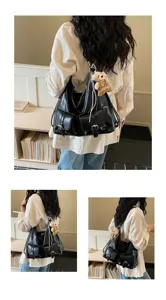 Womens black PU leather multi-pocket shoulder bag casual tote backpack for daily use.
