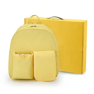 Mochila casual de nailon amarillo con bolsillos delanteros y caja, bolso ligero para estudiantes.