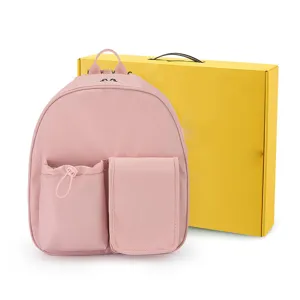 Mochila de nailon rosa con múltiples bolsillos delanteros, bolso casual para escuela y viajes.