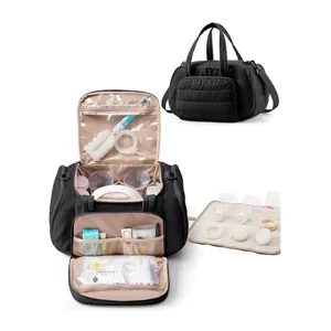 Vue détaillée du sac à tire-lait matelassé noir, rangement multifonction pour biberons