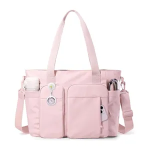 Borsa shopper rosa da infermiera multi-tasche con tracolla per lavoro e viaggio.