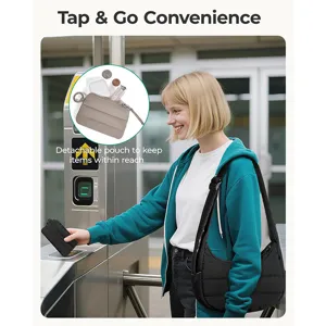 Casual hobo shoulder bag commuting scene detail, lightweight puffer design with detachable pouch.