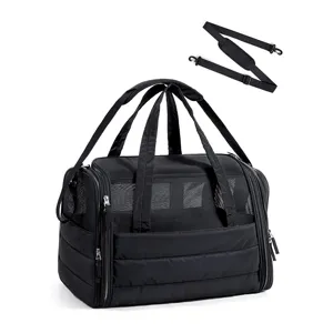 Portable black breathable mesh pet carrier bag with double handles and adjustable shoulder strap.