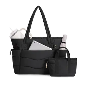 Black puffer tote bag set detail featuring multiple pockets, organized compartments, and durable.