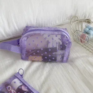 Purple mesh cosmetic bag with flocking heart pattern, portable travel makeup pouch for women.