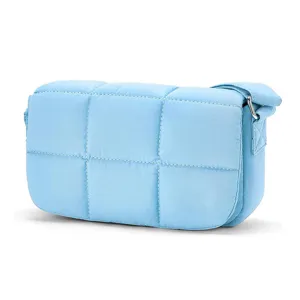 Light blue quilted nylon crossbody bag, lightweight casual shoulder bag with padded grid design.