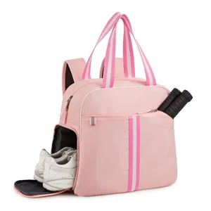 Pink tennis backpack detail showing bottom shoe compartment and side racket pocket for sports.