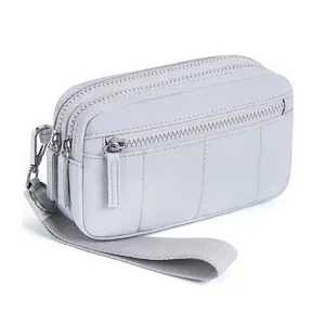 Detailed view of the multi-zipper light grey wrist pouch, highlighting fine stitching.