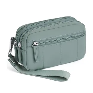 Detail view of the multi-zipper green nylon wristlet phone bag with durable hardware and strap.