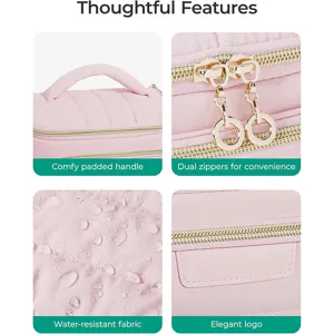 Pink quilted travel cosmetic bag detail view showing soft handle and dual gold zippers.