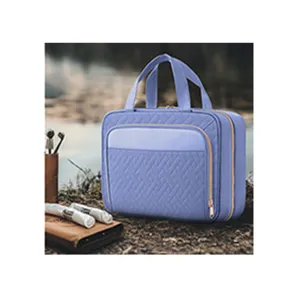 Hanging quilted toiletry bag for women, large capacity travel cosmetic makeup storage pouch.