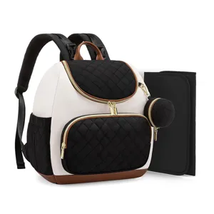 Sac à dos à langer matelassé avec tapis, sac de voyage imperméable maman aux détails dorés.