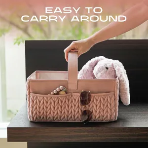 Panier organisateur de couches pour bébé rose avec texture matelassée et poignée