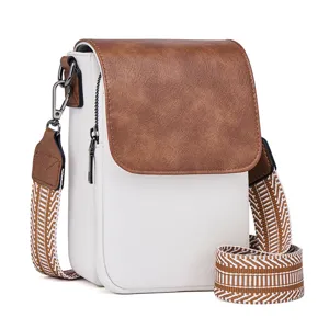 Detailed view of the women PU leather crossbody bag with brown flap and wide strap.