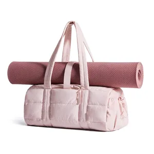 Women puffy quilted shoulder bag mini gym bag with yoga mat strap detail view soft pink