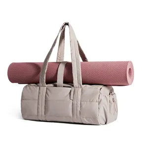 Women Puffy Quilted Gym Duffel Bag Details View with Pink Yoga Mat on Top Light Beige