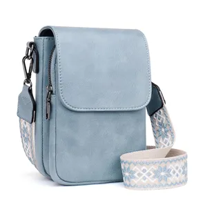 Blue PU leather crossbody bag with wide patterned strap, compact commuter shoulder bag for women.